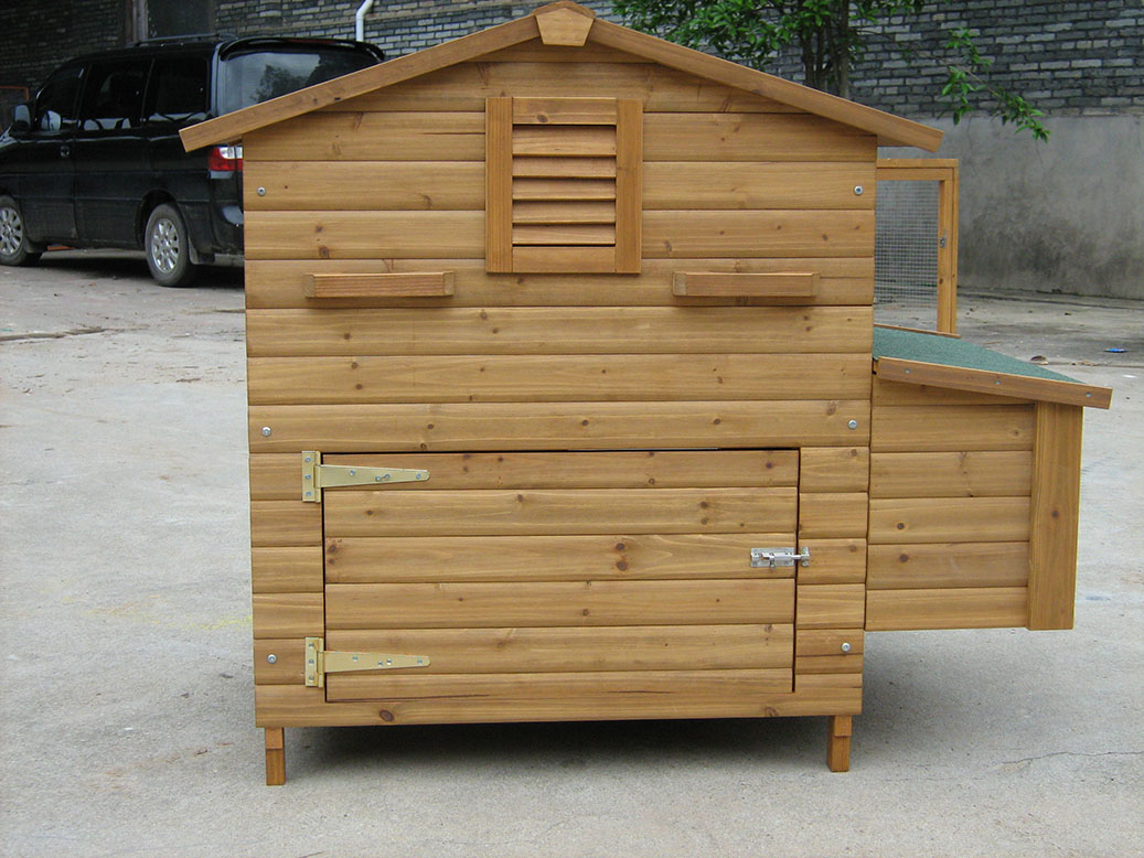 wooden chicken coop with nesting box