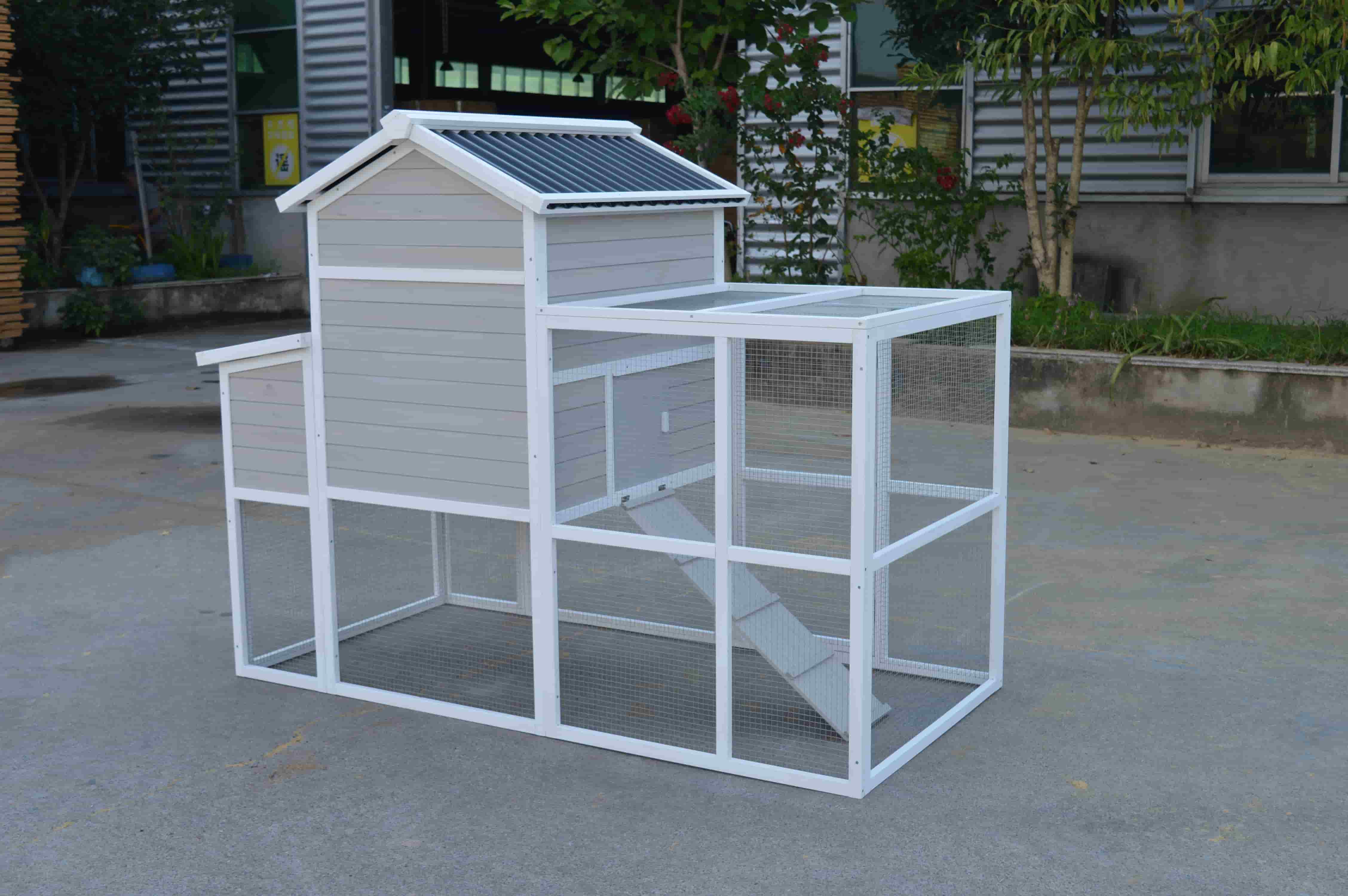 Weatherproof chicken coop with a durable asphalt black roof protecting hens from rain and harsh outdoor elements all year round.